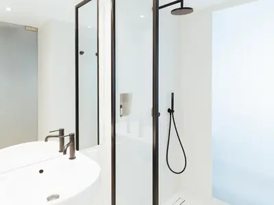 a bathroom with a shower and a sink at Periscope in Athens