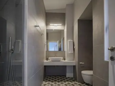 a bathroom with a sink and a toilet and a mirror at A Neoclassical Mansion in Athens in Athens
