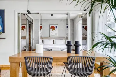 a dining room with a wooden table and chairs at Acropolis Breathtaking View in Athens