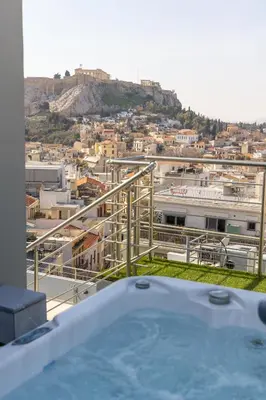 a hot tub on top of a building with a city at Majestic Acropolis-Lycabettus in Athens