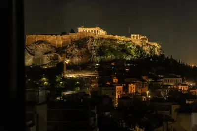 a view of the acropolis of athens at night at Majestic Acropolis-Lycabettus in Athens