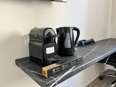 a coffee maker sitting on a counter next to a coffee mug at Penthouse Apartment & Studio near Glyfada - free Parking in Athens
