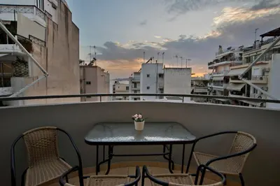 a small table and chairs on a balcony with a view at Ella Suite Piraeus Stylish St, Balcony & Sea View in Piraeus