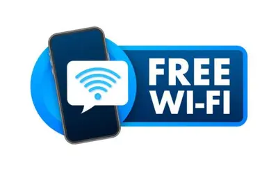 a free wifi sign and a cell phone with a wifi symbol at Metropolis A1-Γοητευτική Σουίτα in Athens