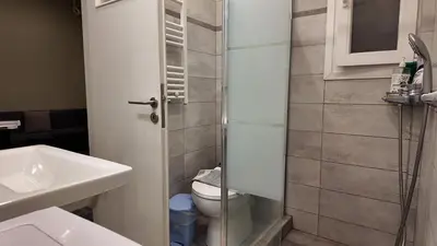 a small bathroom with a toilet and a sink at Athens City Themis 8 in Athens
