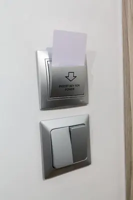 a lightswitch with a box on it on a wall at Athens City Themis 8 in Athens