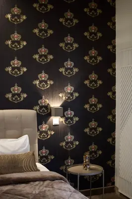 a bedroom with a black and gold wallpaper at Minoa Athens Hotel in Athens