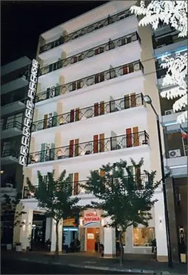 a large white building with trees in front of it at Nafsika Hotel Athens Centre in Athens