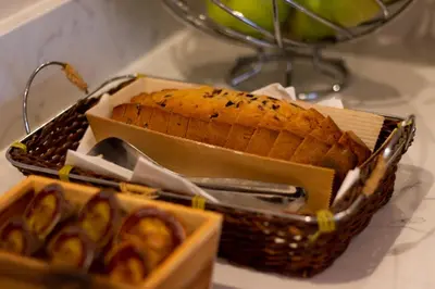a basket of bread and a basket of food at Anemoni Piraeus Hotel in Piraeus