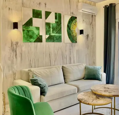 a living room with a white couch and a table at Stylish Apartment in Athens, Walk Everywhere in Athens