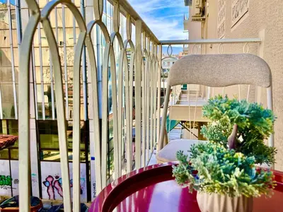 a balcony with a chair and plants on it at Stylish Apartment in Athens, Walk Everywhere in Athens
