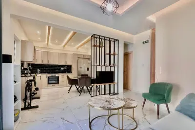 a living room with a couch and a table at Stylish Apartment in Athens, Walk Everywhere in Athens