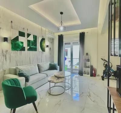 a living room with a couch and a table at Stylish Apartment in Athens, Walk Everywhere in Athens
