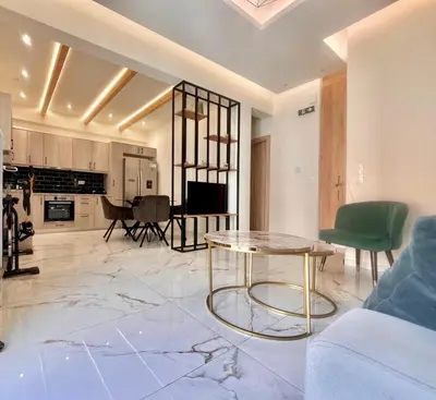 a living room with a couch and a table at Stylish Apartment in Athens, Walk Everywhere in Athens