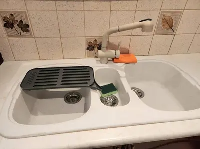 a kitchen sink with a spatula sitting on top of it at Comfy Place In Panteleymon VIPGreece in Athens