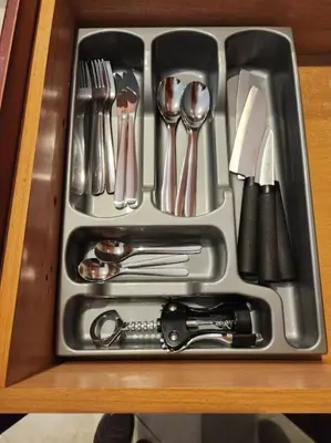 a tray filled with utensils on a table at Comfy Place In Panteleymon VIPGreece in Athens