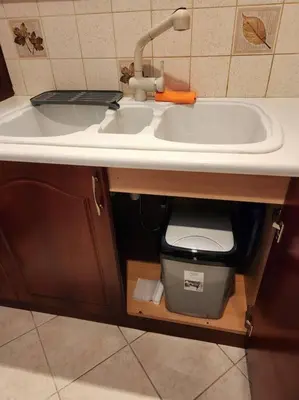 a sink in a bathroom with a trash can under it at Comfy Place In Panteleymon VIPGreece in Athens