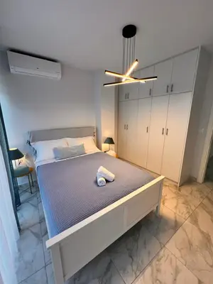 a bedroom with a large bed with a ceiling at Casa de Tres Hermanos in the heart of Athens in Athens