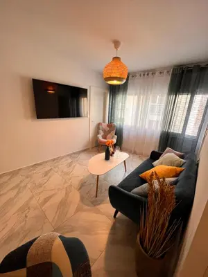 a living room with a couch and a table at Casa de Tres Hermanos in the heart of Athens in Athens