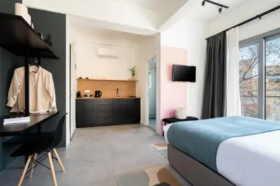 a bedroom with a bed and a desk at Play Psyri Athens a member of Brown Hotels in Athens