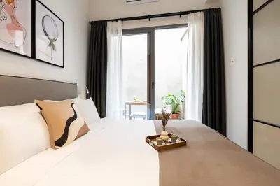 a bedroom with a large white bed and a window at Play Psyri Athens a member of Brown Hotels in Athens