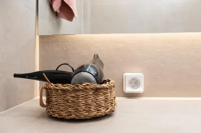 a basket of bathroom items sitting on a counter at Twins apartments - Concert Hall in Athens