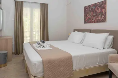 a bedroom with a white bed with a tray on it at Αlpha- Αthenian apartments in Athens