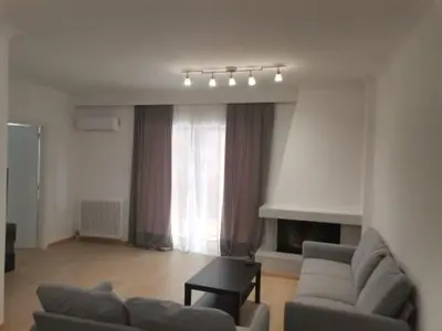 a living room with a couch and a chair at S & K Apartment free indoor parking in Athens