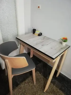 a wooden desk with a chair and a wooden table at Roulas house Διαμέρισμα Κέντρο Σεπόλια ΜΕΤΡΟ in Athens