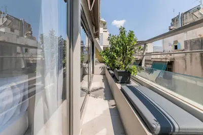 a balcony with a bench on a building at Modern Loft Build on Acropolis Ruins in Athens