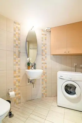 a bathroom with a washing machine and a sink at Modern Loft Build on Acropolis Ruins in Athens
