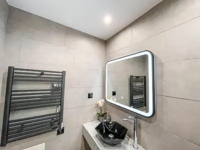 a bathroom with a sink and a mirror at Luxury apartment close to metro & Akropolis- Cielo Homes in Athens