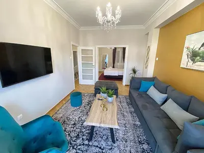a living room with a couch and a table at Check Point - Acropolis View in Athens