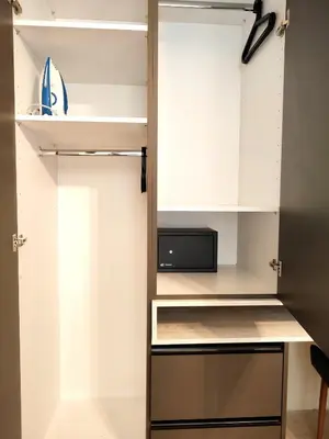 a kitchen with white cabinets and a microwave at Elia Studio in Athens