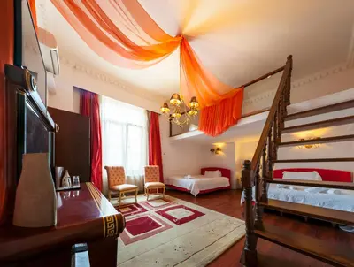 a room with two beds and a staircase in it at Acropolis Museum Boutique Hotel in Athens