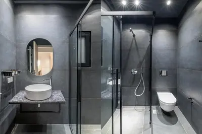 a bathroom with a shower and a sink and a toilet at Premium Apartments in Paleo Faliro by UPSTREET in Athens