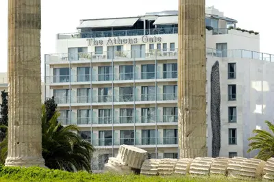 a building with a sign that reads the athens gate at The Athens Gate Hotel in Athens