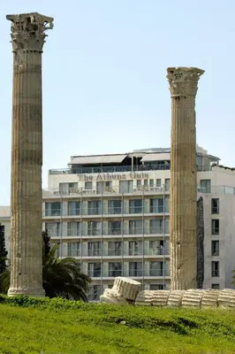 two columns in front of a large building at The Athens Gate Hotel in Athens