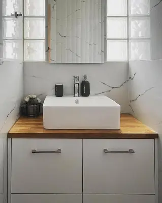 a bathroom with a white sink and a mirror at Athens Hill Suite in Athens