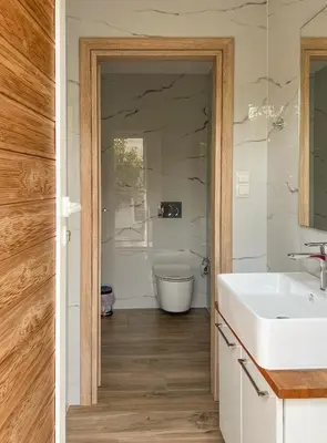 a bathroom with a white sink and a tub at Athens Hill Suite in Athens