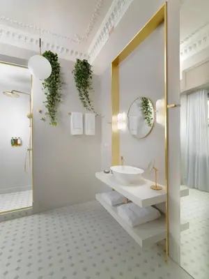 a bathroom with a white sink and a mirror at Monument Hotel in Athens