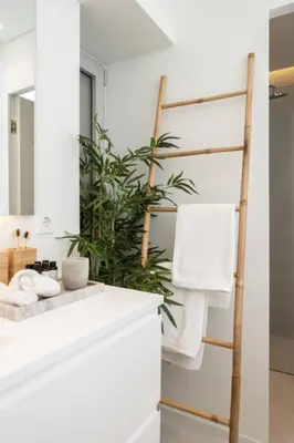 a bathroom with a bamboo towel rack and a sink at 2BD Boho Sea View Apartment by The Olon in Vari