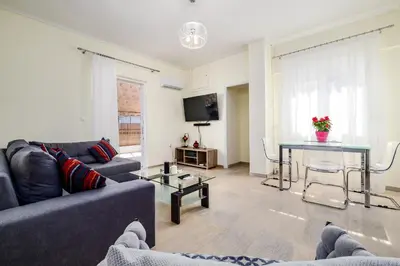 a living room with a couch and a table at Koukaki Apartment in Athens