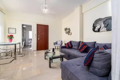 a living room with a couch and a table at Koukaki Apartment in Athens