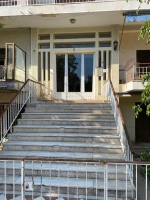 a set of stairs in front of a house at Olivia Luxury Apartment Palio Faliro in Athens