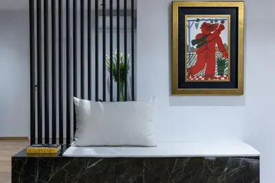 a black radiator in a room with a pillow at Koniama Acropolis in Athens
