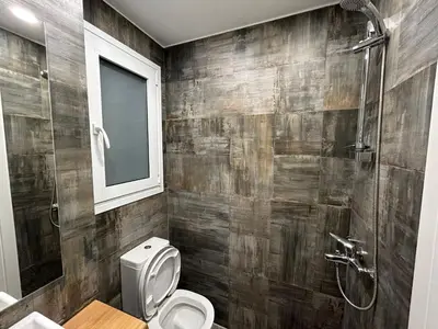 a bathroom with a toilet and a shower at ATHENS SEA VIEW GUEST HOUSE in Athens