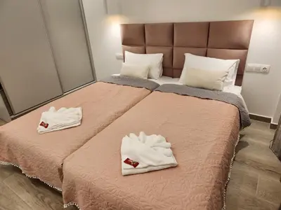 a bedroom with a bed with towels on it at Nice Apartment Near Flisvos VIPGreece in Athens