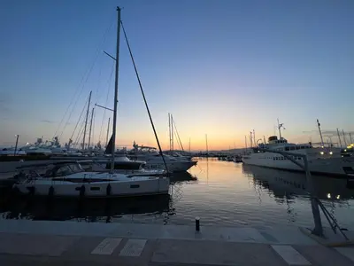 a group of boats docked in a marina at sunset at Riviera-MelRod-Athens in Athens