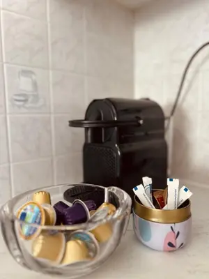 a bowl of easter eggs and a cup ofcolored at Sea View House Voula in Athens